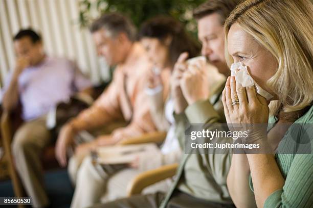 sick people in waiting room - infectious disease stock pictures, royalty-free photos & images
