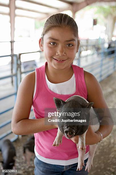 Girl With Pig High-Res Stock Photo