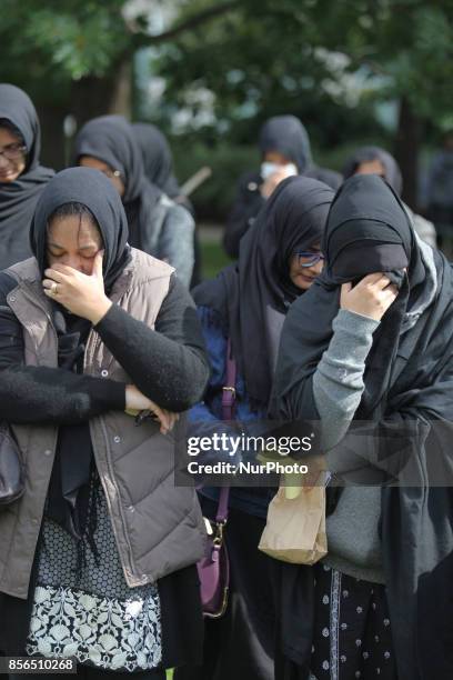 October 2016, Toronto, Ontario, Canada --- Pakistani Shiite Muslims listen to Quranic poetry and cry during the recitation of the story of the death...