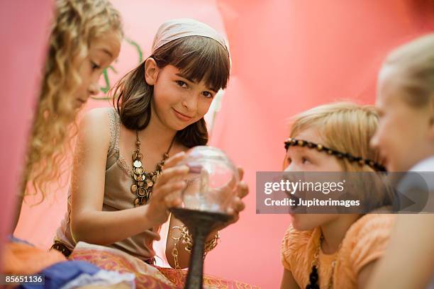 fortune telling girl with crystal ball - objeto mágico imagens e fotografias de stock