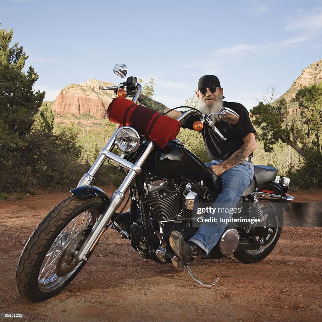 Senior man sitting on motorcycle