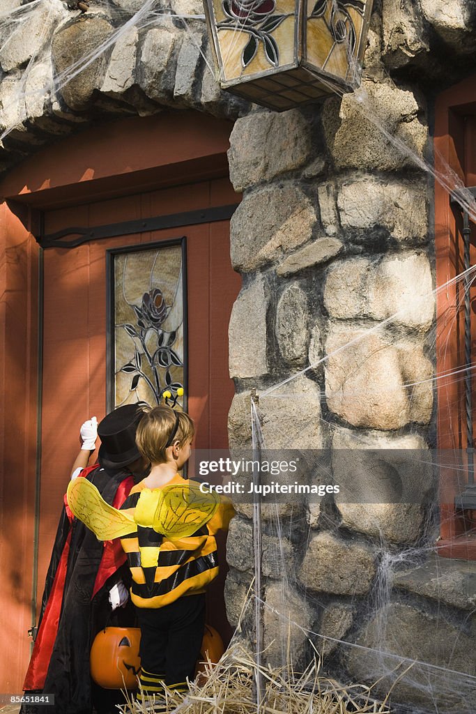 Children in costumes trick-or-treating