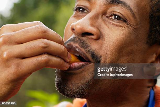 close-up of man eating - tasting 個照片及圖片檔