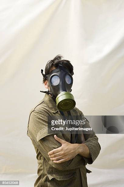 man with gas mask - gasmaske stock-fotos und bilder