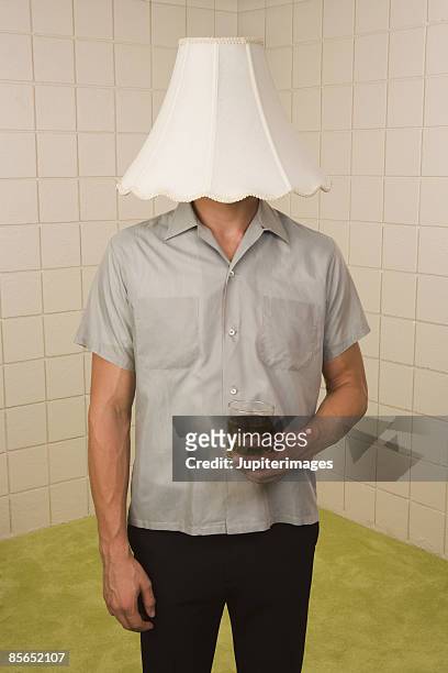 man with lampshade on head - hands covering eyes stock pictures, royalty-free photos & images