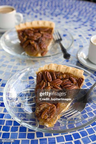 slices of pecan pie with cappuccino on table - pecannusstorte stock-fotos und bilder