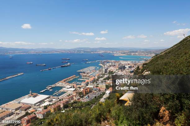 gibraltar - view from the nature reserve "upper rock" to the city and port of gibraltar, bay of algeciras and algeciras (spain) - algeciras stockfoto's en -beelden