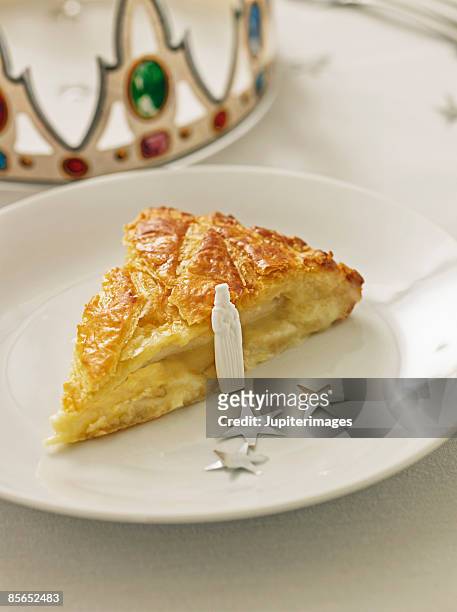 epiphany king's cake with crown and figurine - king cake stock pictures, royalty-free photos & images