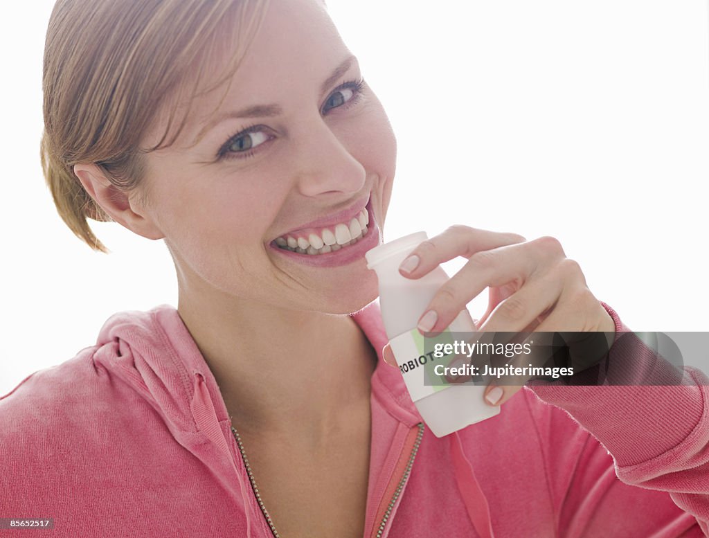 Woman with probiotic drink