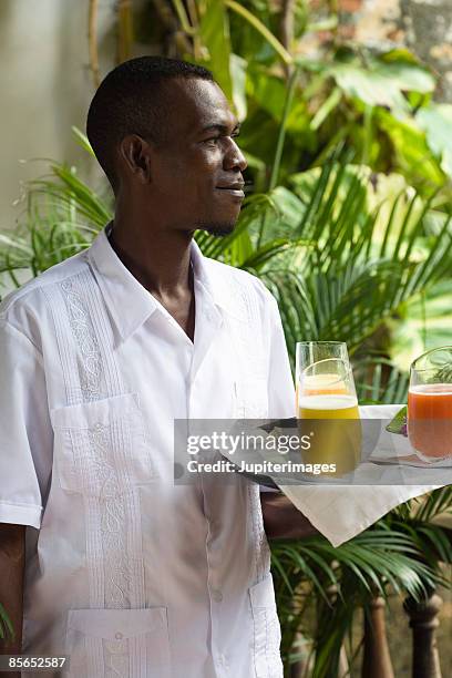 waiter with tray of drinks - cartagena colombia stock pictures, royalty-free photos & images