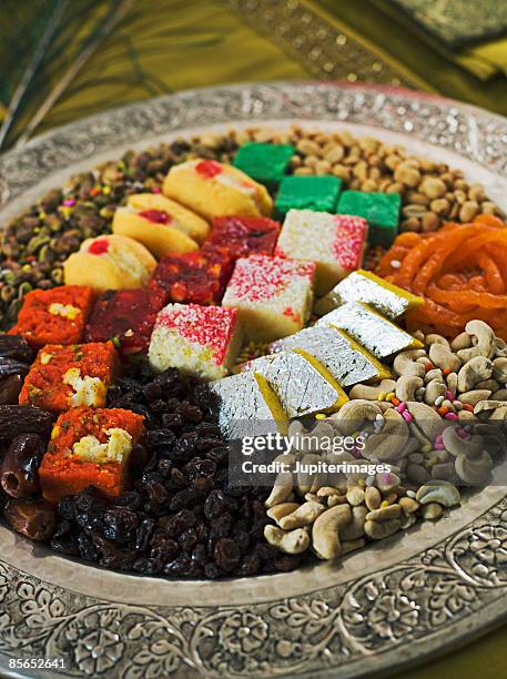 platter of diwali sweets - diwali sweets stock-fotos und bilder