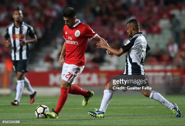 Benfica forward Pizzi from Portugal with Portimonense SC midfielder Paulinho from Brazil in action during the Primeira Liga match between SL Benfica...