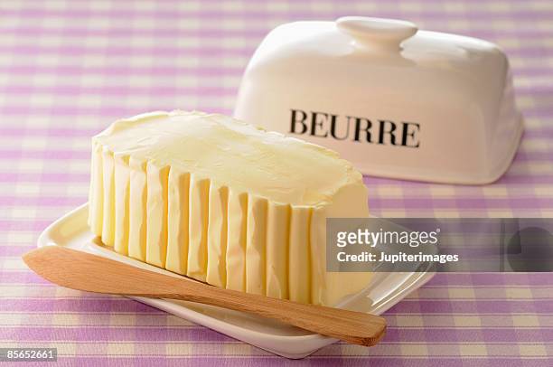 molded butter in ceramic dish - butter knife stock pictures, royalty-free photos & images
