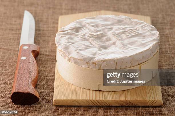 camembert cheese and knife - camambert stock pictures, royalty-free photos & images