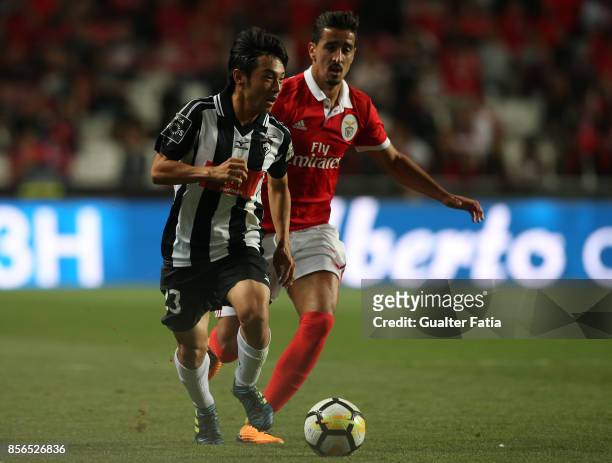 Portimonense SC forward Shoya Nakajima from Japan with SL Benfica defender Andre Almeida from Portugal in action during the Primeira Liga match...