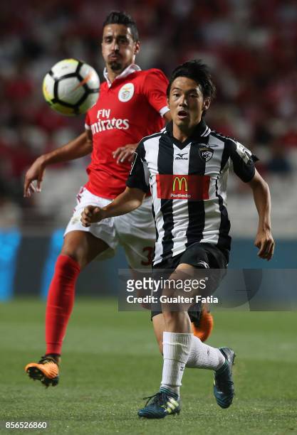 Portimonense SC forward Shoya Nakajima from Japan with SL Benfica defender Andre Almeida from Portugal in action during the Primeira Liga match...