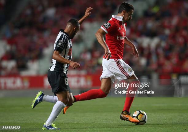 Benfica defender Andre Almeida from Portugal with Portimonense SC midfielder Paulinho from Brazil in action during the Primeira Liga match between SL...