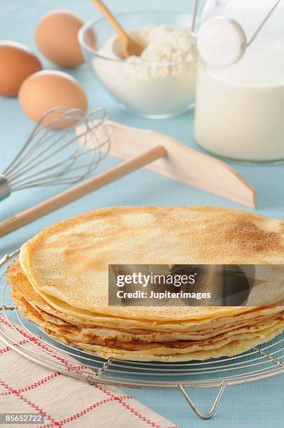 stack of crepes with ingredients and utensils - pancake stock pictures, royalty-free photos & images