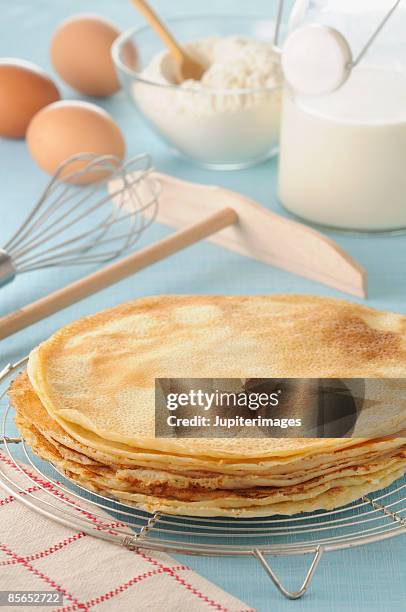 stack of crepes with ingredients and utensils - crepe pancake stock pictures, royalty-free photos & images