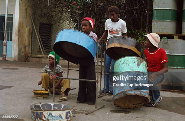 children playing drums , saint lucia , caribbean - tamburo steel drum foto e immagini stock