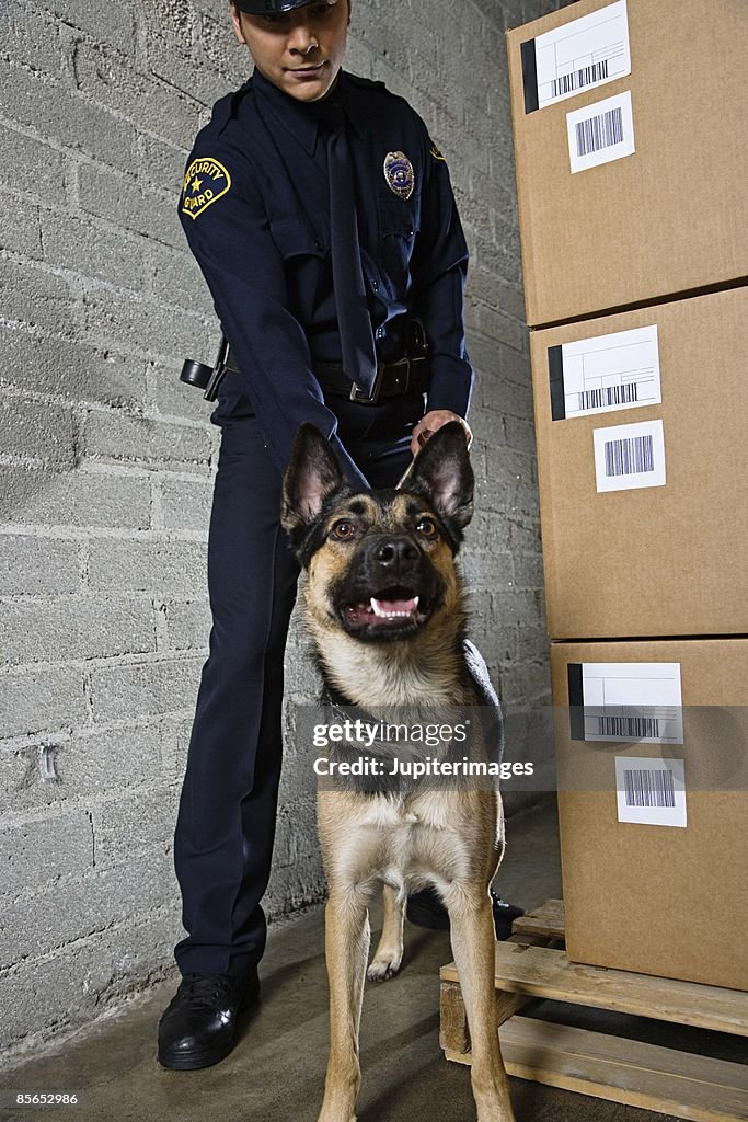 Working Line Guard Dog Security Guard With Dog In Warehouse High-Res Stock Photo - Getty Images