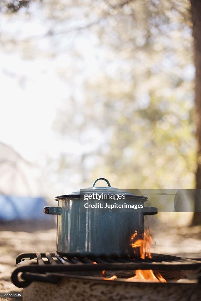 Pot on grill at campsite