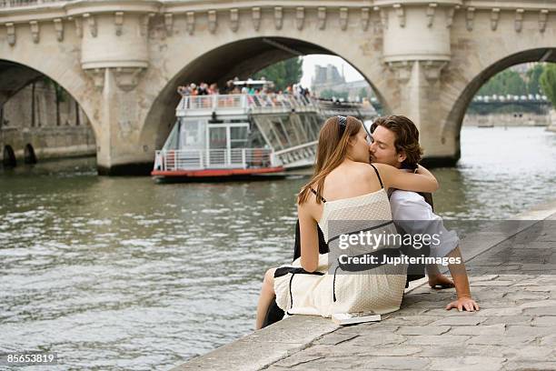 couple kissing , seine river , paris , france - seine maritime stock pictures, royalty-free photos & images