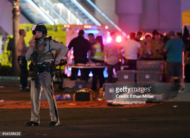 Las Vegas Metropolitan Police officer stands in the intersection of Las Vegas Boulevard and Tropicana Ave. After a mass shooting at a country music...