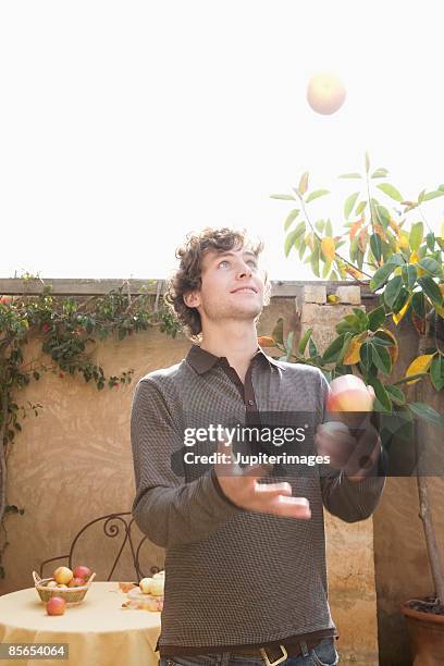 Throwing An Apple Photos and Premium High Res Pictures - Getty Images