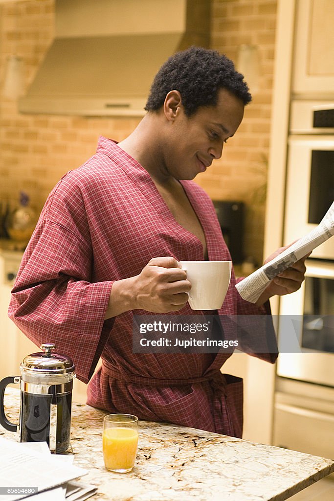 Man with coffee and newspaper