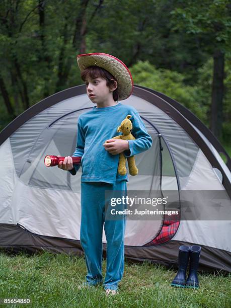 boy wearing cowboy hat holding flashlight and stuffed bear - bear camping stock pictures, royalty-free photos & images