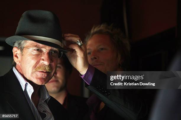 Musician and store owner Matt Sorum helps actor Pat O'Brien try on a hat at the launch of the new Sorum Noce Collection at the Sorum Noce Store on...