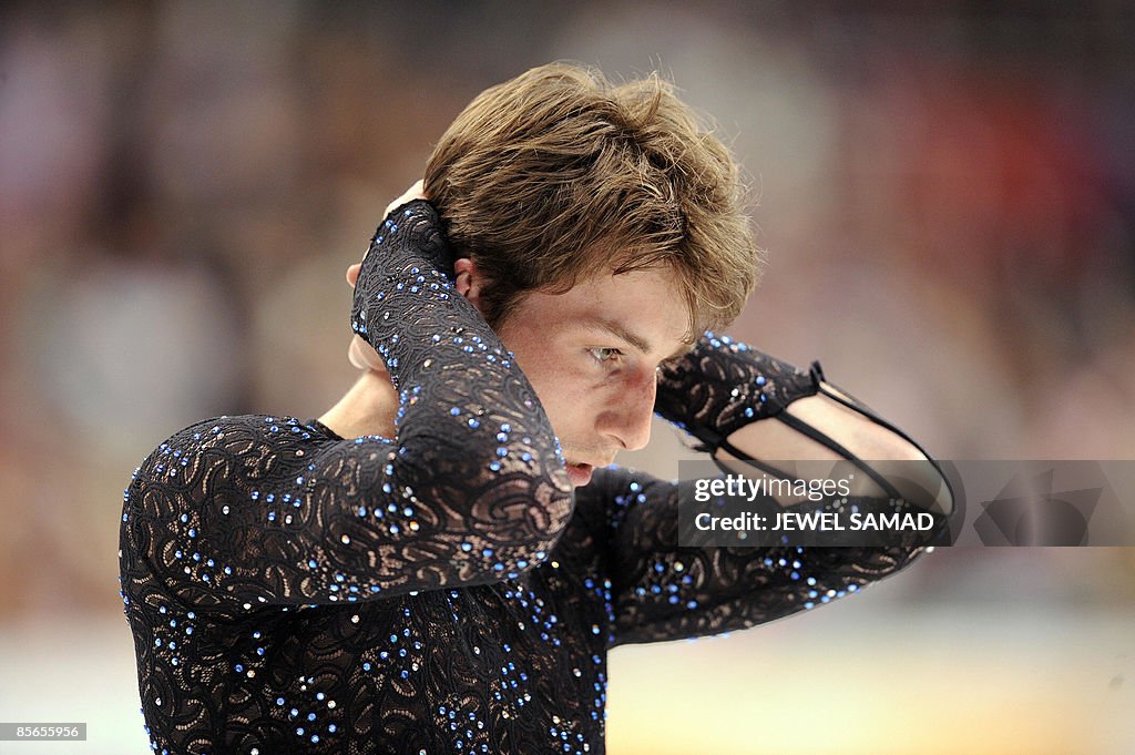 Brian Joubert of France reacts after the
