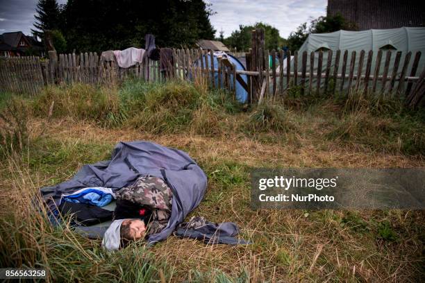 Woman sleeps near Camp for Forest becouse lack of free space inside. &quot;Camp for Forest&quot; Pogorzelce near Bialowieza on August 15, 2017