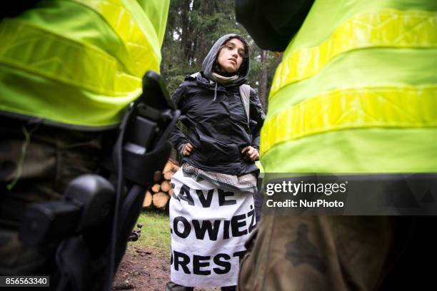 Activist woman during interrogation by Border Guard unit after blockade of Harvester. Bialowieski forest on September 22, 2017.