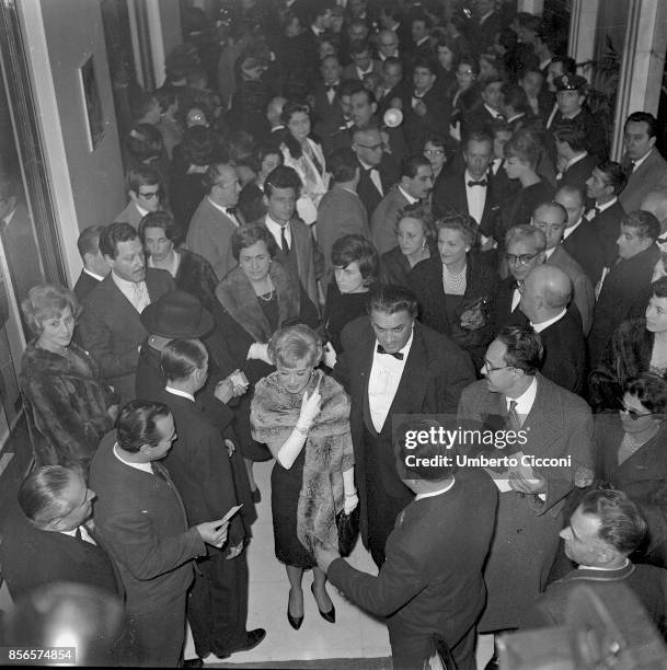 Italian film director Federico Fellini at the 'Cinema Fiamma' for the premiere of 'La Dolce Vita' movie with his wife and actress Giulietta Masina,...