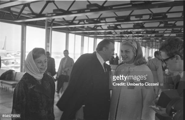 Italian film director Federico Fellini is at Fiumicino Airport with his wife and actress Giulietta Masina and actress Sandra Milo leaving for a trip...