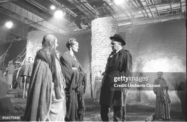 Movie director Federico Fellini talking to two actors while directing the movie 'Satyricon' in 1969.