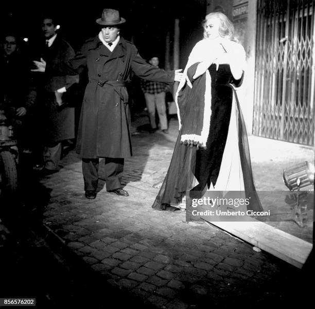 Film director Federico Fellini with actress Anita Ekberg during the shooting of movie 'La Dolce Vita', Rome 1959.