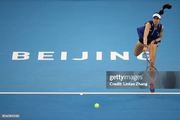 Christina McHale of the United States returns a shot against Sloane Stephens of the United States during the women's singles first round on day three...