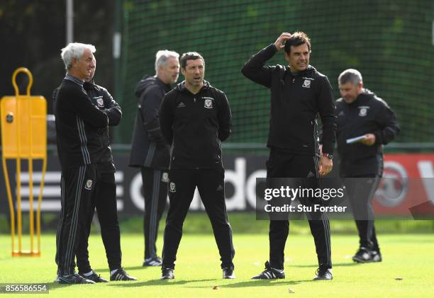 Wales coach Chris Coleman and his coaching staff share a joke with Ian Rush look on during Wwales training ahead of their World Cup Qualifiers at...