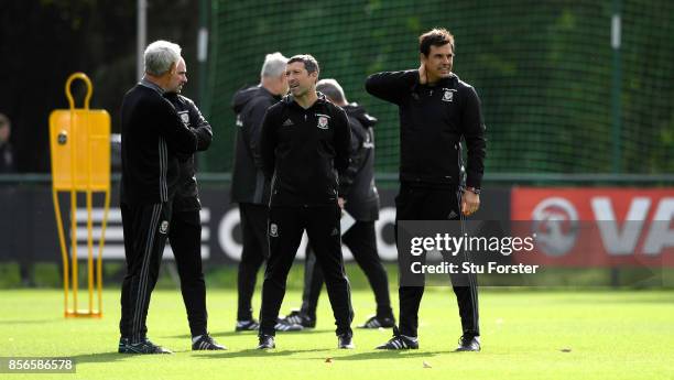 Wales coach Chris Coleman and his coaching staff share a joke with Ian Rush look on during Wwales training ahead of their World Cup Qualifiers at...