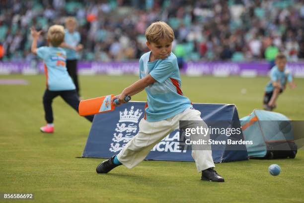 Youngsters participate in an All Stars Cricket session during the interval at the 4th Royal London One Day International between England and West...