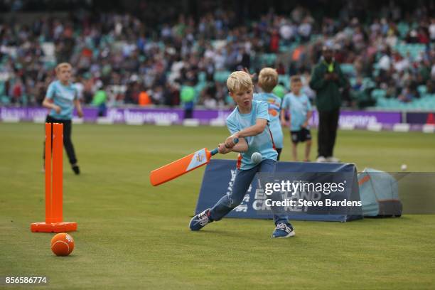 Youngsters participate in an All Stars Cricket session during the interval at the 4th Royal London One Day International between England and West...