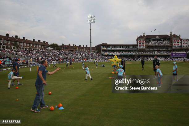 Youngsters participate in an All Stars Cricket session during the interval at the 4th Royal London One Day International between England and West...