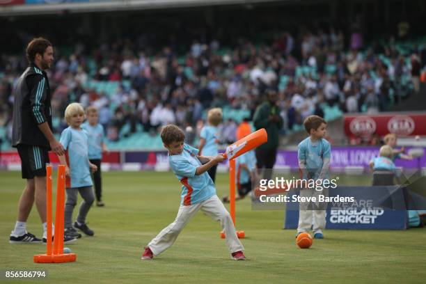 Youngsters participate in an All Stars Cricket session during the interval at the 4th Royal London One Day International between England and West...