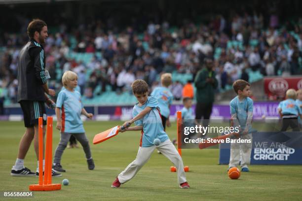 Youngsters participate in an All Stars Cricket session during the interval at the 4th Royal London One Day International between England and West...