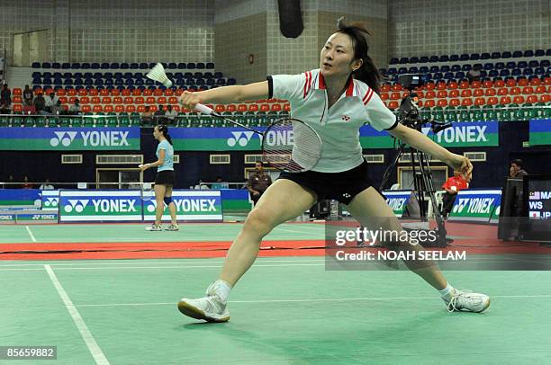 Japanese badminton player Yu Hirayama returns a shot to Malaysian opponent Mew Choo Wong during their women's singles quarter final match of the...