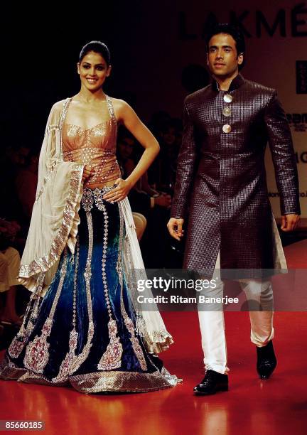 Bollywood Actors Genelia D'souza and Tushar Kapoor walk the runway at the Skoda Superb's Manish Malhotra show during the Lakme India Fashion Week...