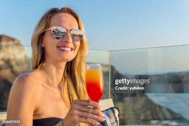 enjoying fresh drink - mirrored sunglasses stock pictures, royalty-free photos & images